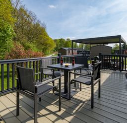 An outdoor patio with a table and chairs at The Woods in Great Ayton
