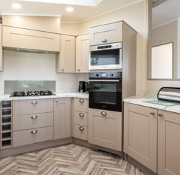 A kitchen with cabinets and appliances at Rosedale in Great Ayton