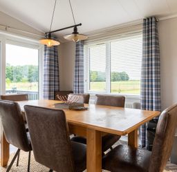 A dining room with a table and chairs at Rosedale in Great Ayton