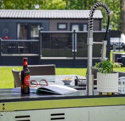 An outdoor patio with a sink and table at Leven (Pet) in Great Ayton