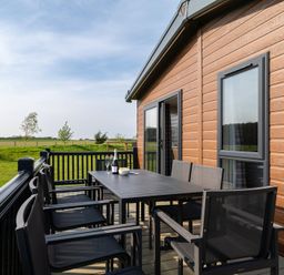 An outdoor patio with a table and chairs at Roseberry in Great Ayton
