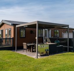A house with a deck and patio furniture at Roseberry in Great Ayton