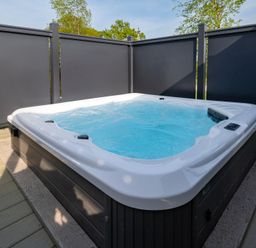 A hot tub on a wooden deck at Roseberry in Great Ayton