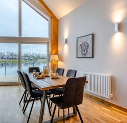 A dining room with a table and chairs at Tranquillity 3 (Pet) in Carnforth