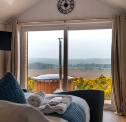 A bedroom with a hot tub view at The Grays in North Berwick