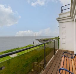A balcony overlooking the sea at The Old Signal House in Torpoint