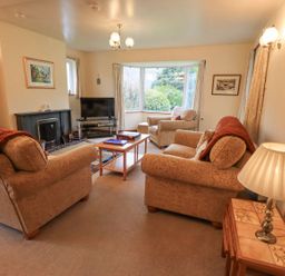 A living room with sofas and a television at Thrang View in Chapel Stile
