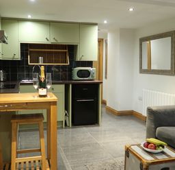 A kitchen with a countertop and modern appliances at Rockfish Cottage in Brixham