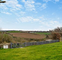 A view of fields and fence at Jack's House in Marhamchurch