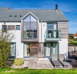 A house with balcony and patio area at Arundell in Marhamchurch