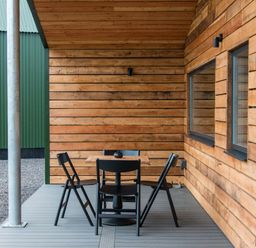 An outdoor seating area with a table and chairs at The Telfer in North Berwick