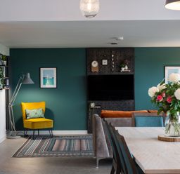 A living room with a sofa and dining table at The Irvine in North Berwick