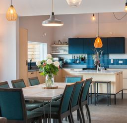 A kitchen with a dining table and chairs at The Irvine in North Berwick