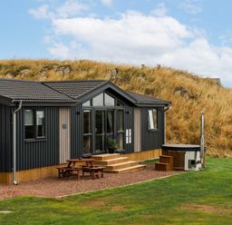 A building with wooden steps and a hot tub at The Townsend in North Berwick