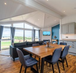 A living room with a dining area and kitchen at The Townsend in North Berwick