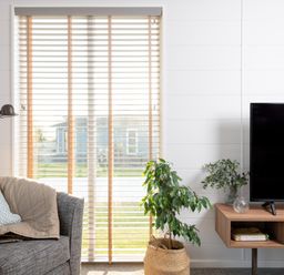 A living room with a television and sofa at Mullion Spa in Bude