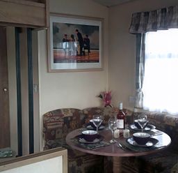 A dining area with a table set for meals at Coopers Beach Holiday Park - Holiday Accommodation 3999 Mersea Island