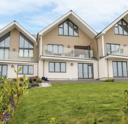 A house with balconies and glass doors at Praa Waves in Penzance