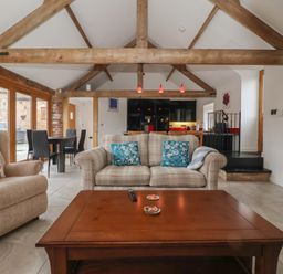 A living room with a sofa and coffee table at Pillar Barn Driffield