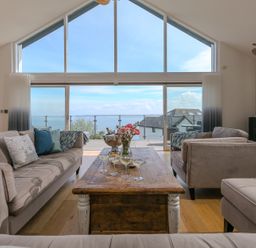A living room with a coffee table and sofas at 2 Remera in St Ives