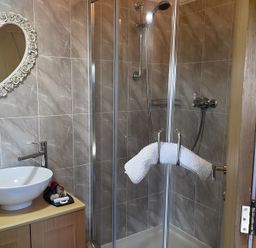 A bathroom with a shower and sink at Tylands in Camelford