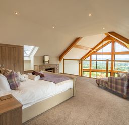 A bedroom with a bed and furniture at Valley View Lodge 1 Preston