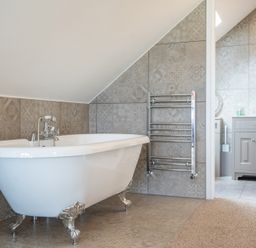 A bathroom with a bathtub and sink at Valley View Lodge 1 in Preston