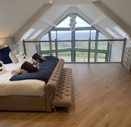 A bedroom with a bed and view at Pendle View in Preston