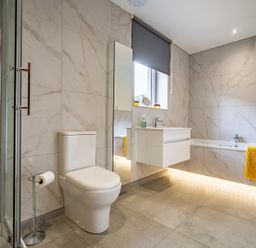 A bathroom with a shower, sink, toilet, and bathtub at Pendle View Preston