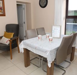 A dining room with a table and chairs at The Farmhouse in Omagh