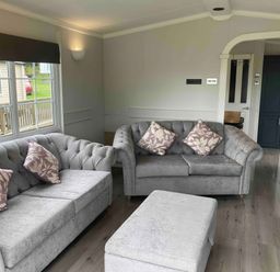 A living room with two sofas and a coffee table at Caravan 38 in Newport