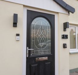 An entrance door with a decorative design at Mables in Wigton
