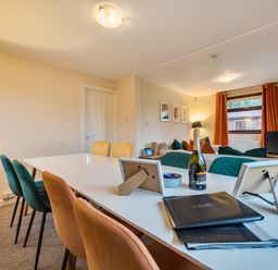 A dining room with a table and chairs at Cabin 1 Moffat Manor Beaufort