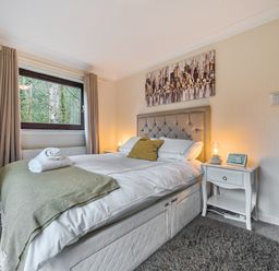 A bedroom with a bed and nightstand at Cabin 1 Moffat Manor in Beaufort