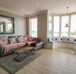 A living room with a sofa and coffee table at Cootiya Corner in Great Lyth