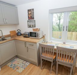 A kitchen with a sink and countertop at Heidiaway Lodge in Gilfach Goch
