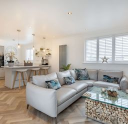 A living room with a sofa and coffee table at 6 Tegafan in Abergele