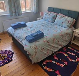 A bedroom with a bed and bedside table at 17 Castleview in Ballymena