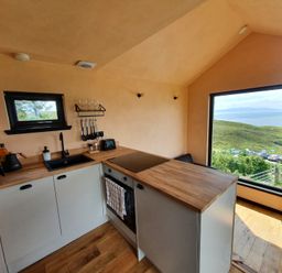 A kitchen with a stove and sink at Cullinview Isle of Skye