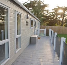 A deck area with windows and storage box at Orchid 9 Christchurch