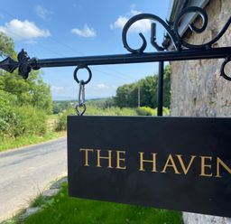 A sign that reads THE HAVEN outdoors at The Haven in Penrith