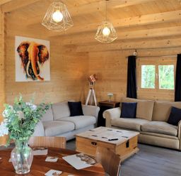 A living room with a sofa and coffee table at Cotswold Nights Away in Evesham