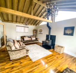 A living room with a sofa and coffee table at Fox Lodge York