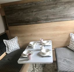 A dining area with a table set for meals at Inverness Lodge in Inverness