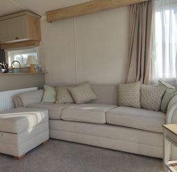 A living room with a sofa and coffee table at Harbour View in Poole