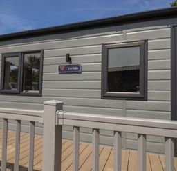 The exterior of The Oaks with windows and door at The Oaks 2 Bedrooms Delamere