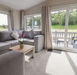 A living room with a sofa and coffee table at The Oaks 2 Bedrooms in Delamere