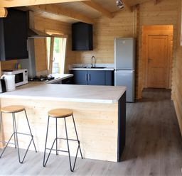A kitchen with a refrigerator, stove, and sink at Cotswold Nights Away, Evesham
