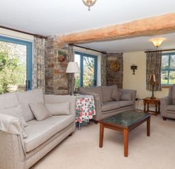 A living room with sofas and a coffee table at Pillars in Barnstaple