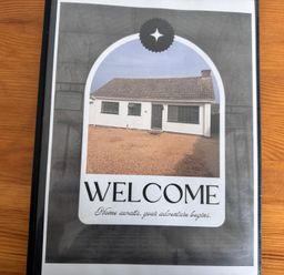 A house exterior with a sign saying welcome at 15 Lamsey Lane in King's Lynn